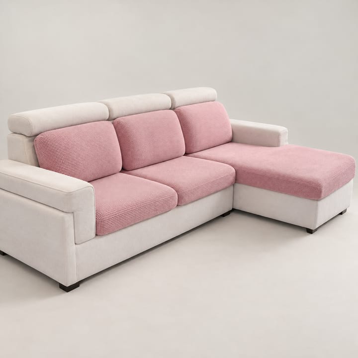 Blush pink grid plush covers on the seat and back cushions of a sectional sofa