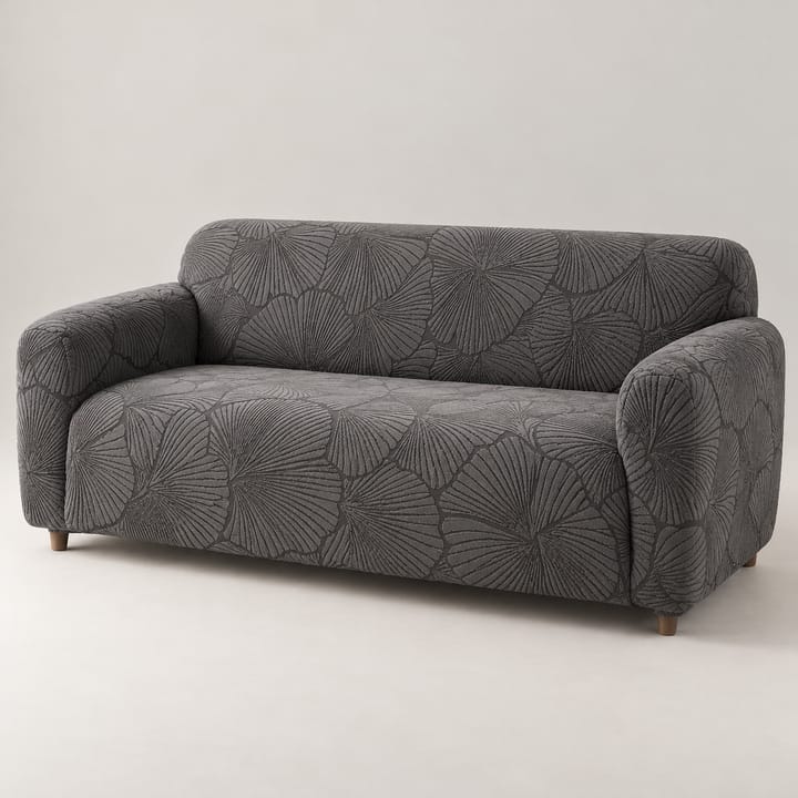 Charcoal leaf jacquard stretch cover on a 3-seat sofa
